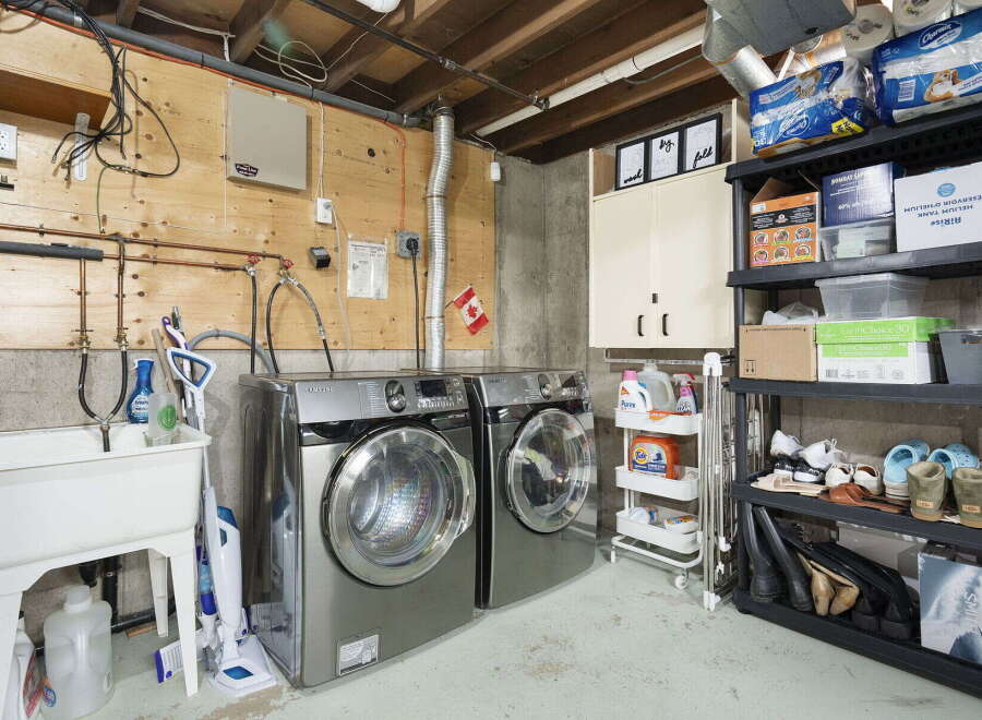 Discover the ultimate laundry room setup in this home, featuring a spacious Samsung washer and dryer set for efficient cleaning.