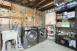 Discover the ultimate laundry room setup in this home, featuring a spacious Samsung washer and dryer set for efficient cleaning.