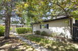 Discover this charming property featuring a well-maintained exterior with a textured stucco finish and a classic asphalt shingle roof.