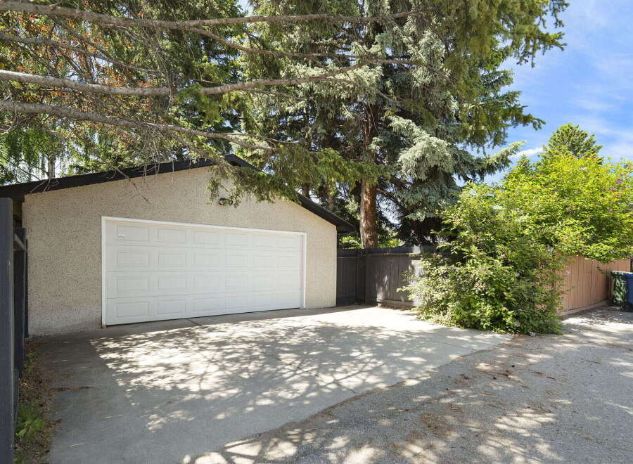Discover ample parking and storage with this spacious detached garage, perfect for vehicles or hobbies.