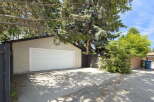 Discover ample parking and storage with this spacious detached garage, perfect for vehicles or hobbies.
