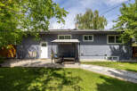 Enjoy outdoor living in this charming backyard featuring a spacious patio perfect for entertaining.