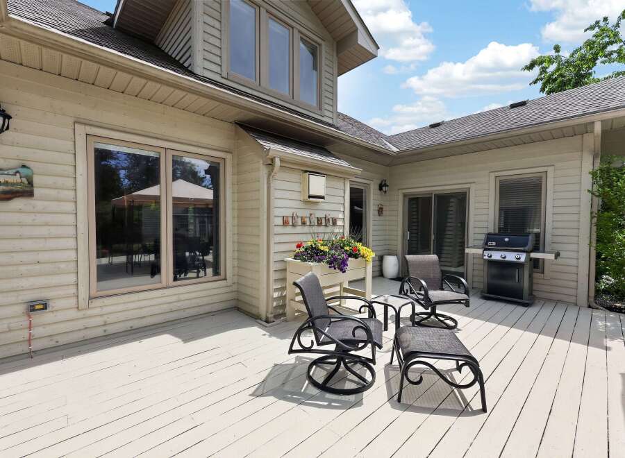 Enjoy outdoor living on this spacious deck, perfect for entertaining or relaxing.