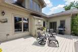 Enjoy outdoor living on this spacious deck, perfect for entertaining or relaxing.