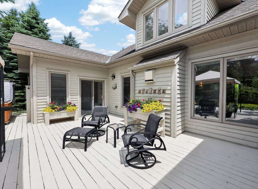 Enjoy outdoor living on this expansive deck, perfect for entertaining or relaxing.