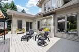 Enjoy outdoor living on this expansive deck, perfect for entertaining or relaxing.