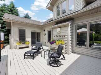 Enjoy outdoor living on this expansive deck, perfect for entertaining or relaxing.