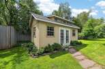 Discover this charming backyard shed, perfect for storage or as a creative studio space.