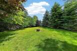 Enjoy outdoor living in this spacious backyard, perfect for entertaining or relaxing.