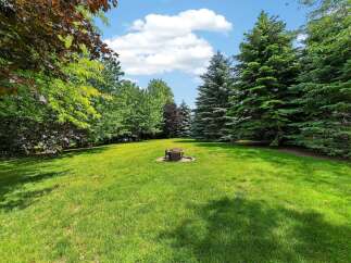 Enjoy outdoor living in this spacious backyard, perfect for entertaining or relaxing.