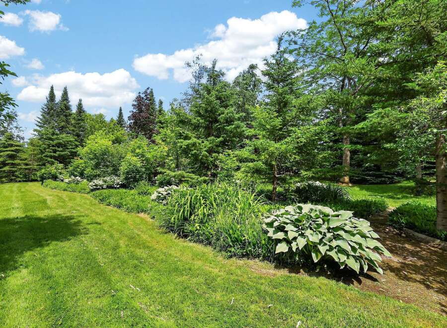 Discover a beautifully landscaped backyard oasis perfect for outdoor living and entertaining.