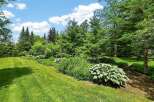 Discover a beautifully landscaped backyard oasis perfect for outdoor living and entertaining.