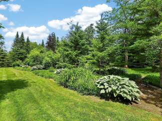Discover a beautifully landscaped backyard oasis perfect for outdoor living and entertaining.