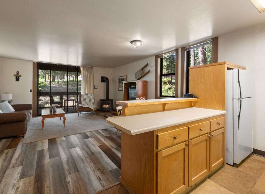 Experience cozy living in this charming cabin featuring a wood-burning stove and a spacious living area perfect for relaxation.