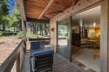 Enjoy the serene mountain setting from this charming cabin's private deck, perfect for morning coffee or evening relaxation amidst the tall pines.