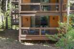 Experience mountain living with this charming property featuring multiple levels of outdoor space, perfect for enjoying the surrounding nature.