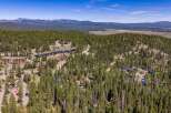Nestled amidst a dense pine forest, this property offers a serene mountain retreat with stunning natural beauty.