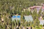 Experience luxury living with access to pristine tennis courts nestled amidst a lush pine forest.