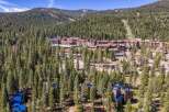Nestled amidst a dense pine forest, this property offers a serene mountain retreat with stunning views.
