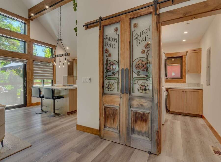 Step into a unique living space featuring rustic charm and modern amenities.