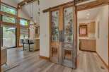 Step into a unique living space featuring rustic charm and modern amenities.