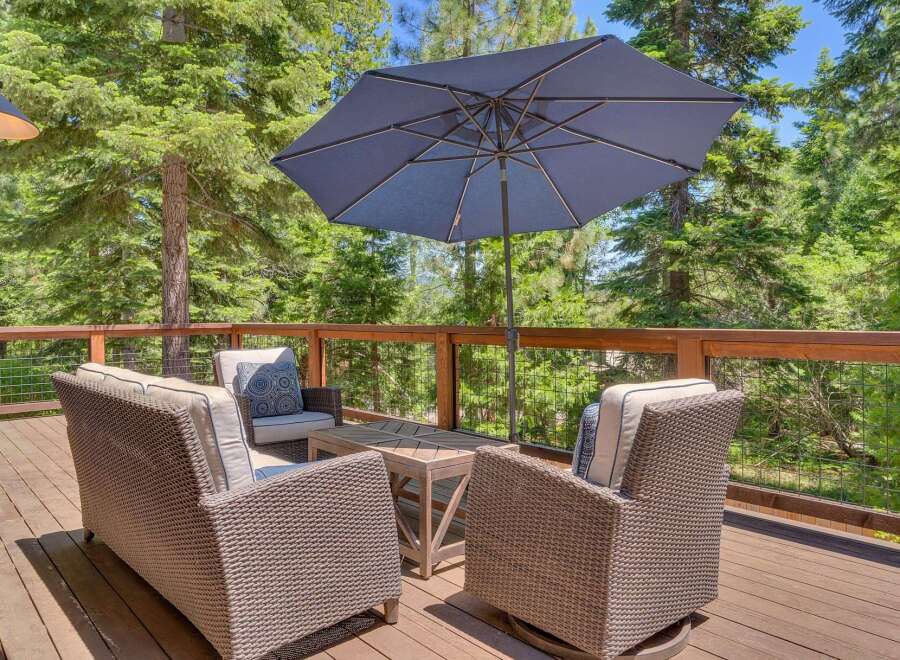 Enjoy the serene mountain views from this spacious deck, perfect for outdoor entertaining.