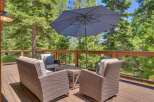 Enjoy the serene mountain views from this spacious deck, perfect for outdoor entertaining.
