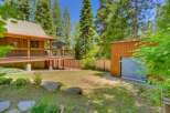 Experience rustic charm with this wooden cabin featuring a spacious deck perfect for outdoor relaxation.