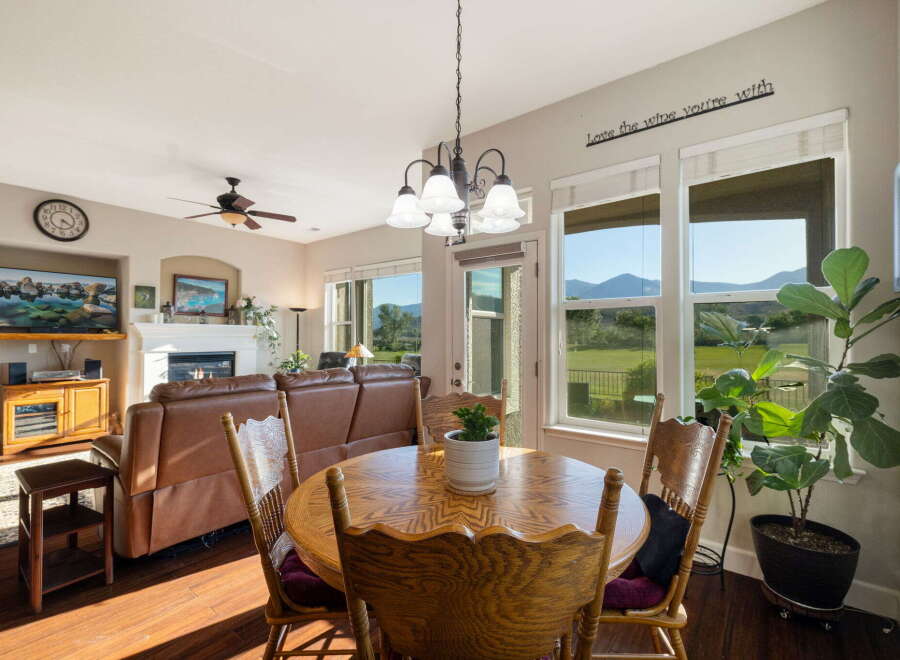 Enjoy breathtaking mountain views from this inviting dining area, perfect for family gatherings or intimate meals.