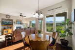 Enjoy breathtaking mountain views from this inviting dining area, perfect for family gatherings or intimate meals.