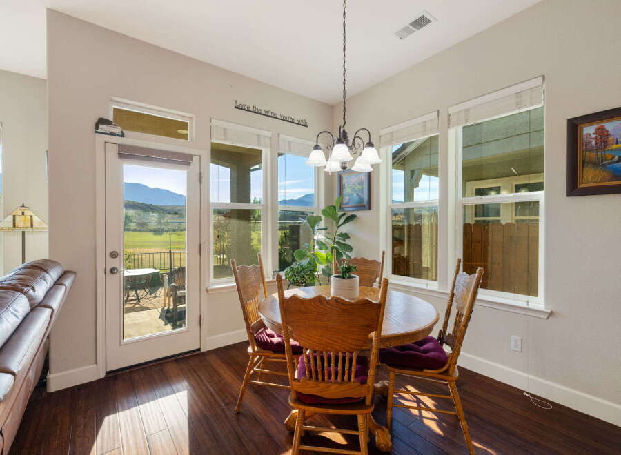Enjoy breathtaking mountain views from this charming dining area, perfect for intimate meals or lively gatherings.