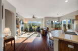 Experience breathtaking mountain views from this stunning living area, featuring a cozy fireplace and ample natural light.