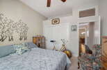 This charming bedroom features a comfortable bed adorned with decorative pillows and a stylish comforter.