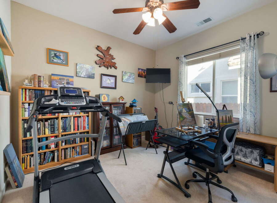 This versatile room offers a perfect blend of fitness and creativity, featuring a treadmill for your workouts and an art station with easels and supplies for your artistic endeavors.