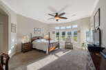 This spacious bedroom offers a luxurious retreat with a comfortable king-sized bed and a cozy armchair.