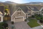 Discover this stunning home featuring a beautifully paved driveway leading to a spacious two-car garage.