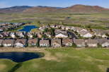 Discover this stunning residential community nestled against a backdrop of rolling hills and serene water features.