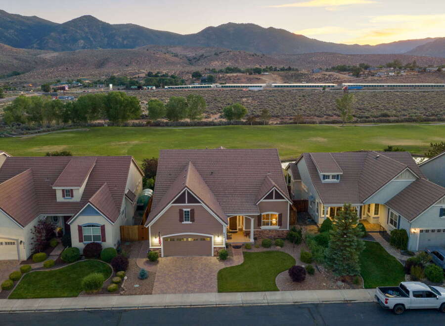 Experience luxury living in this stunning home, boasting a beautifully landscaped yard and a spacious driveway perfect for entertaining.