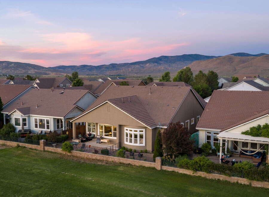 Experience stunning sunset views from this beautiful home, perfectly situated against a backdrop of rolling hills.