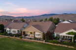 Experience stunning sunset views from this beautiful home, perfectly situated against a backdrop of rolling hills.