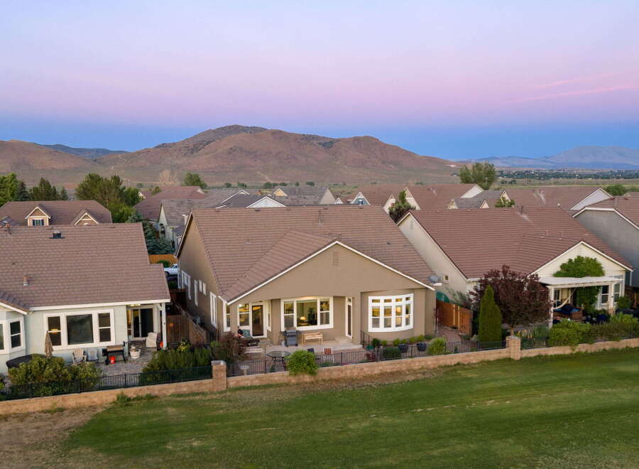 This stunning single-family home offers a spacious backyard perfect for entertaining, complete with a patio and barbecue area.
