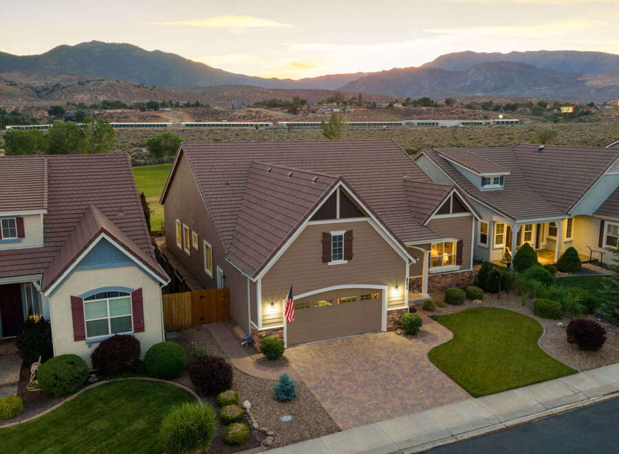 Discover this stunning home featuring a beautifully landscaped yard and a spacious driveway perfect for entertaining.