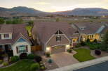 Discover this stunning home featuring a beautifully landscaped yard and a spacious driveway perfect for entertaining.