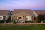 This charming home features a spacious backyard patio, perfect for entertaining guests or enjoying a quiet evening outdoors.