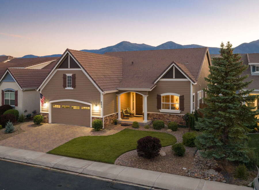 Discover this charming single-family home nestled against a stunning mountain backdrop.