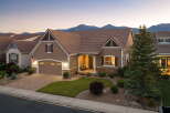 Discover this charming single-family home nestled against a stunning mountain backdrop.
