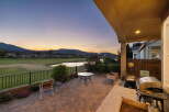 Enjoy breathtaking sunset views from this stunning patio, complete with a built-in grill and ample seating.