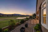 Enjoy breathtaking sunset views over the golf course and a serene lake from this stunning property.