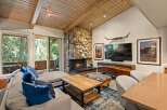Experience rustic charm in this inviting living room, featuring a magnificent stone fireplace as the centerpiece.