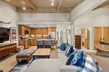 Experience modern mountain living in this stunning open-concept space, featuring a gourmet kitchen with custom wood cabinetry and a spacious living area perfect for entertaining.